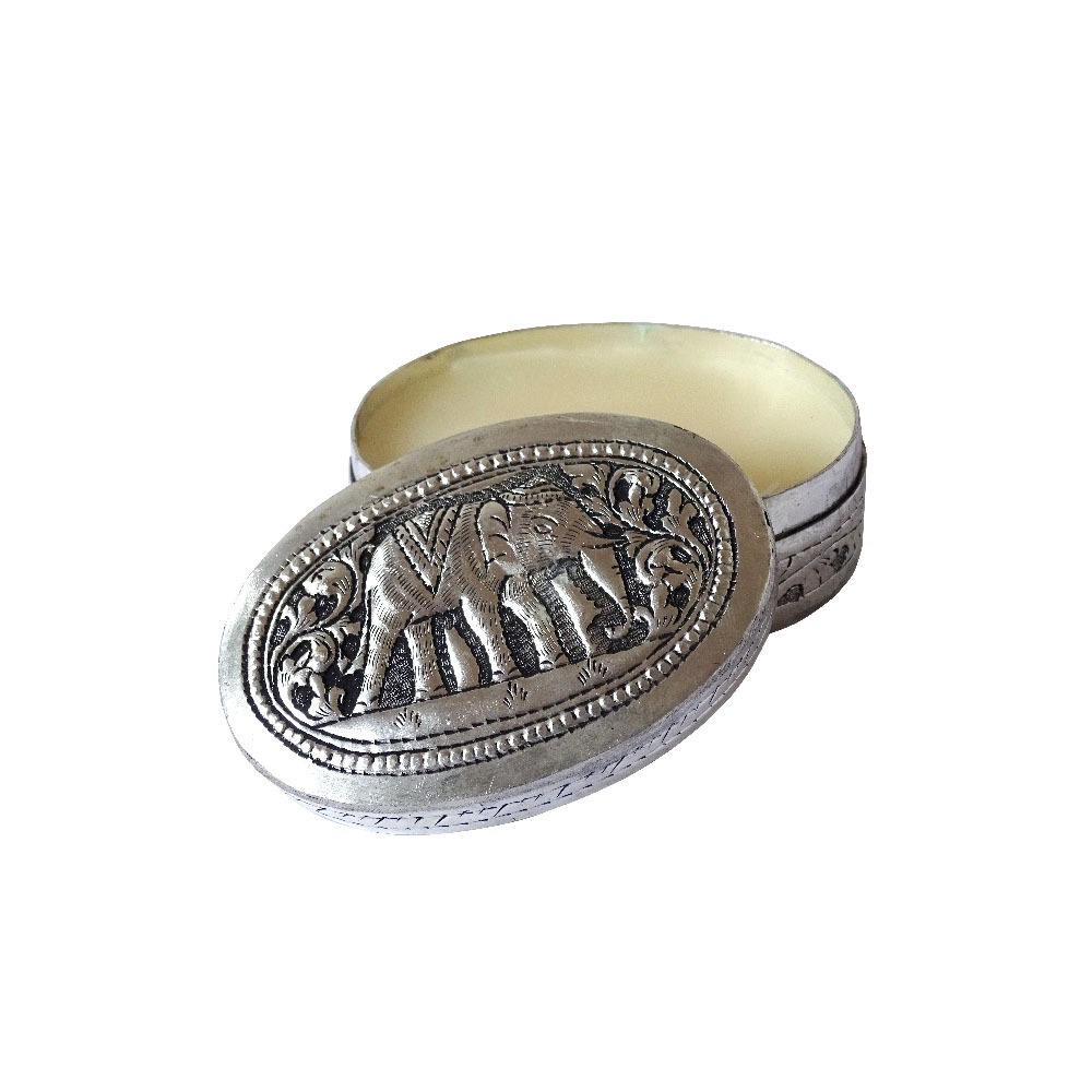 Candle in oval silver box, opened